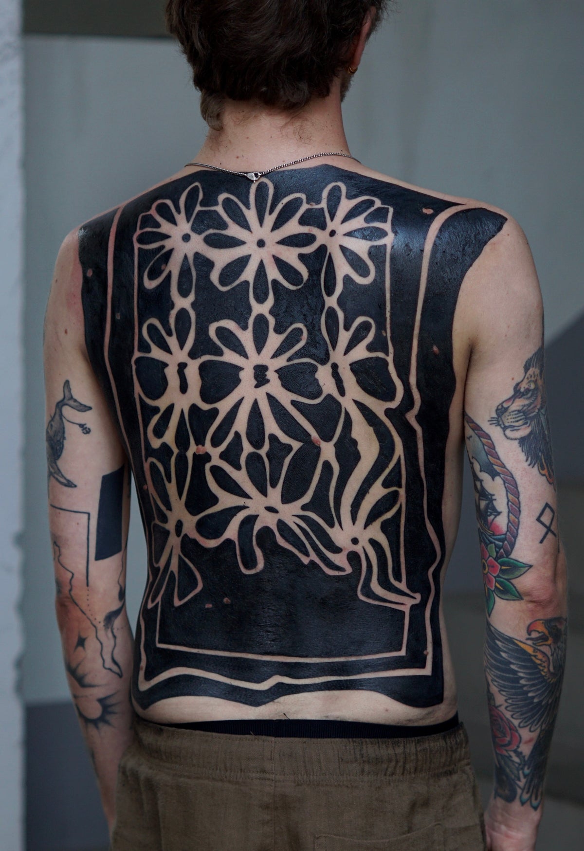 Ornamental blackwork back tattoo from Emi's portfolio